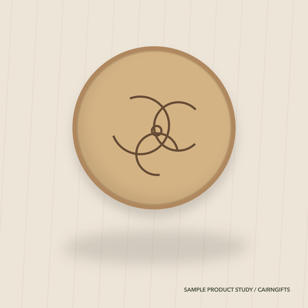 Round ash-coloured sample plaque with an original triple spiral engraving
